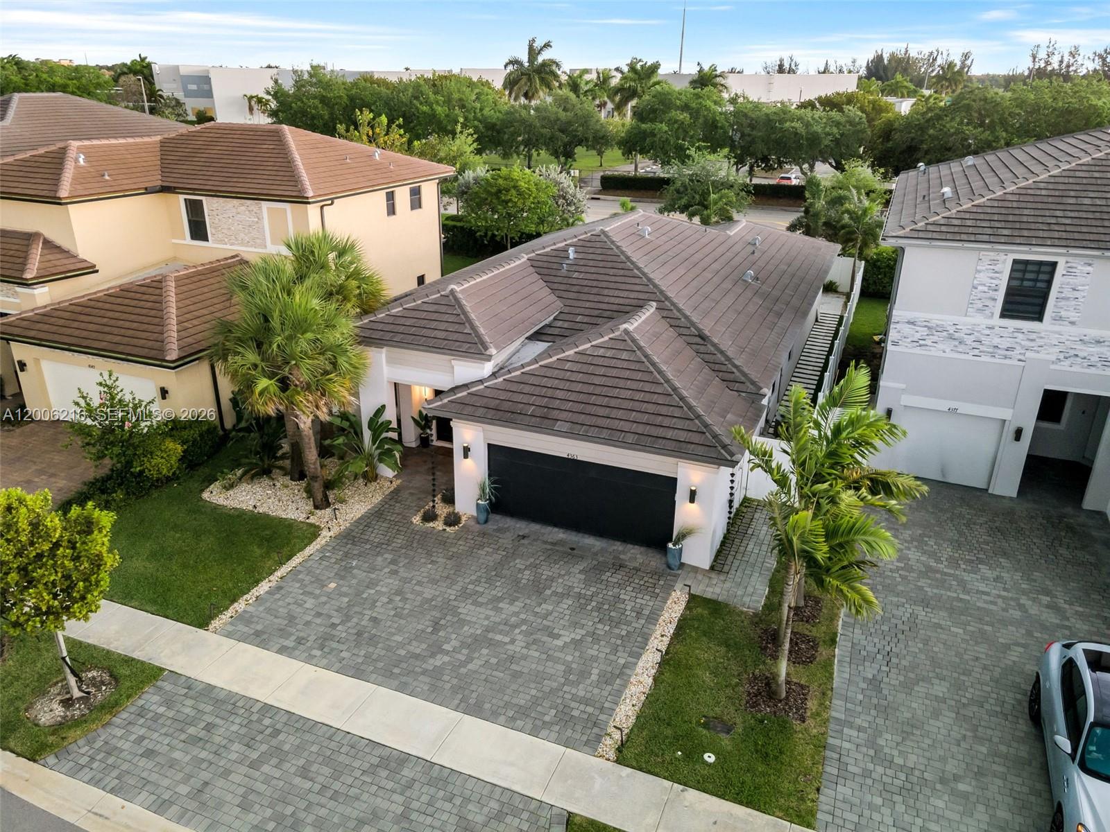 An aerial view shows a single-story house with a dark tiled roof and paved driveway — 4363 SW 173rd Ave, Miramar FL 33029, MIRAMAR, FL