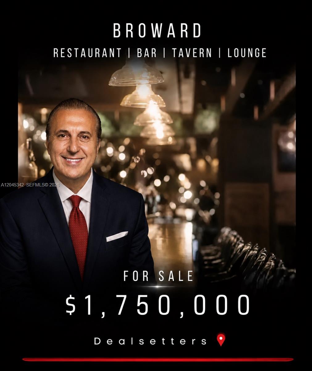 A man in a suit stands in front of a blurred restaurant interior for sale — FORT LAUDERDALE, FL
