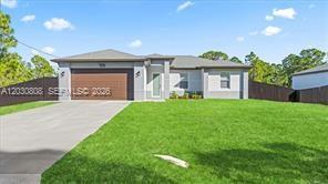 A single-story house with a brown garage door, concrete driveway, and a green lawn — 759 SILVERSTAR AVE S, Lehigh Acres FL 33974, LEHIGH ACRES, FL