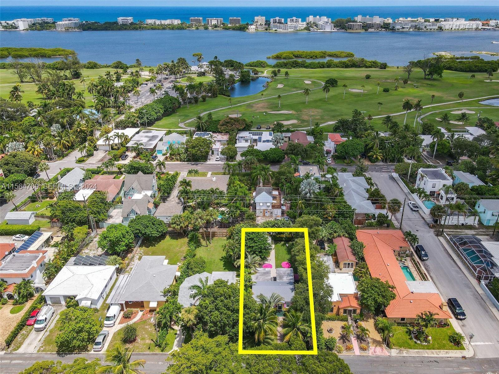 An aerial view shows a single-story house outlined in yellow within a residential neighborhood — 612 N Palmway, FL 33460, FL