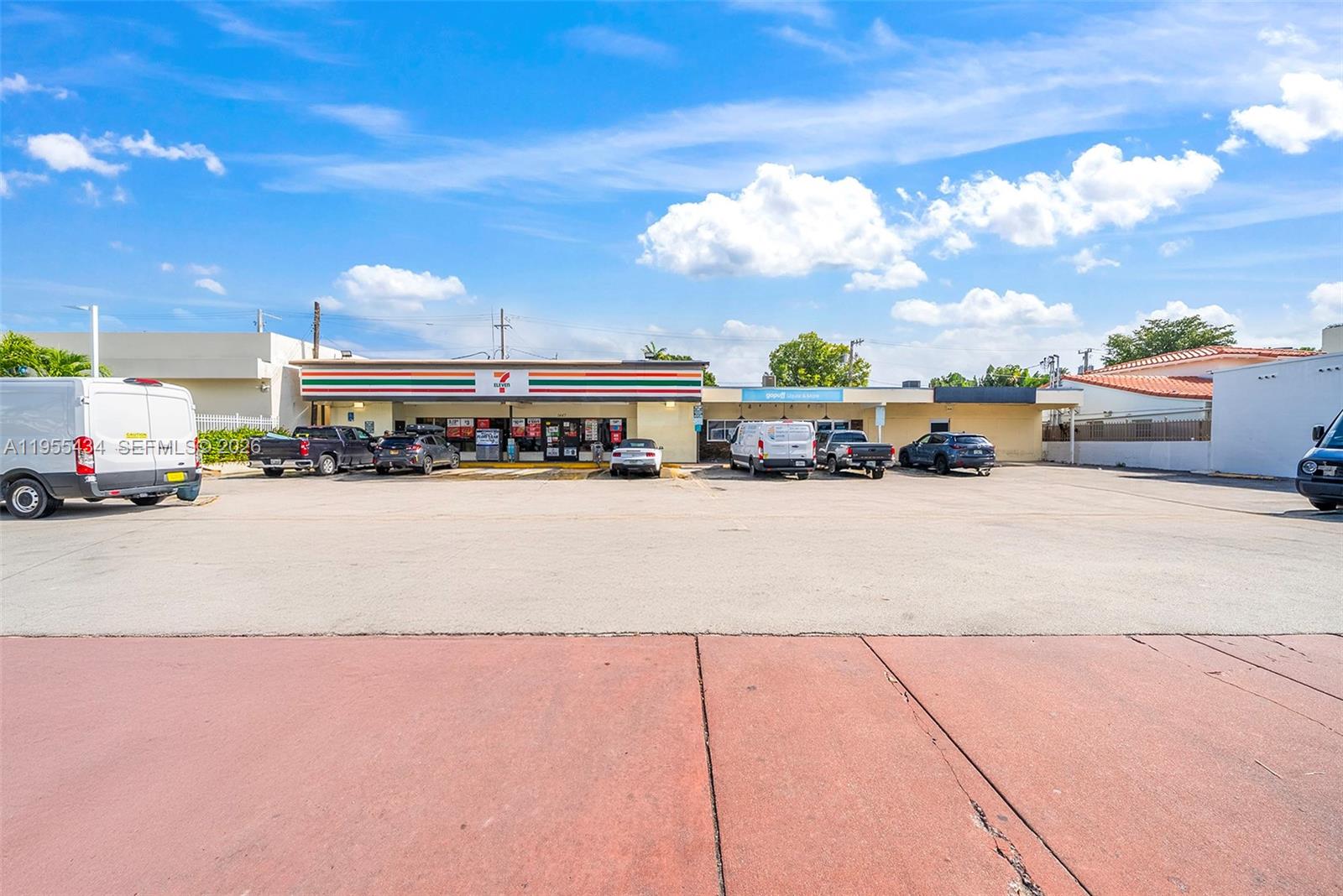 A 7-Eleven store and adjacent business sit behind a large, paved parking lot — 1441 Alton Rd, Miami Beach FL 33139, MIAMI BEACH, FL