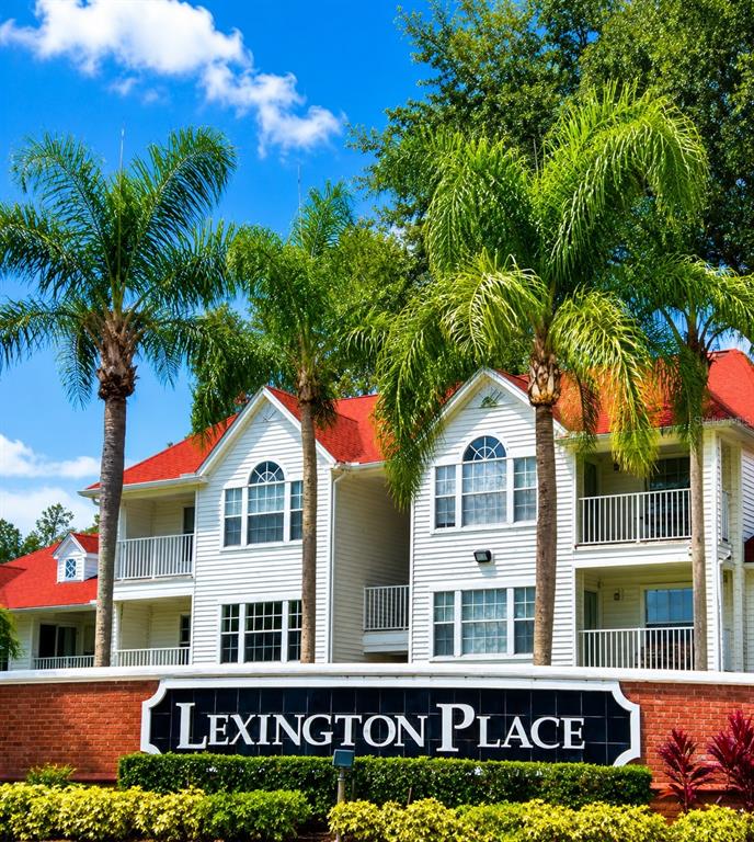 A two-story apartment building with a red roof stands behind a Lexington Place sign — 11574 WESTWOOD BOULEVARD UNIT 1126, ORLANDO, FL