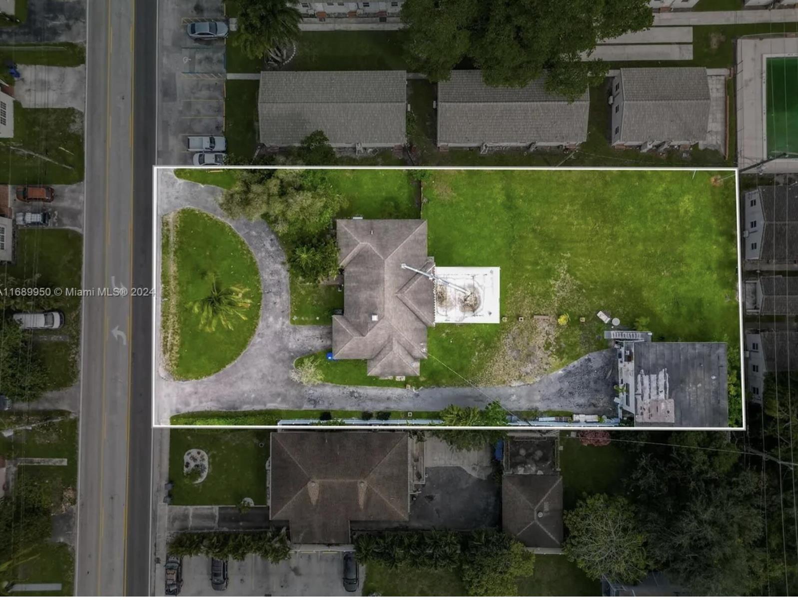 An aerial view shows a house with a circular driveway and a large backyard — 2646 Johnson Street, Hollywood FL 33020, HOLLYWOOD, FL