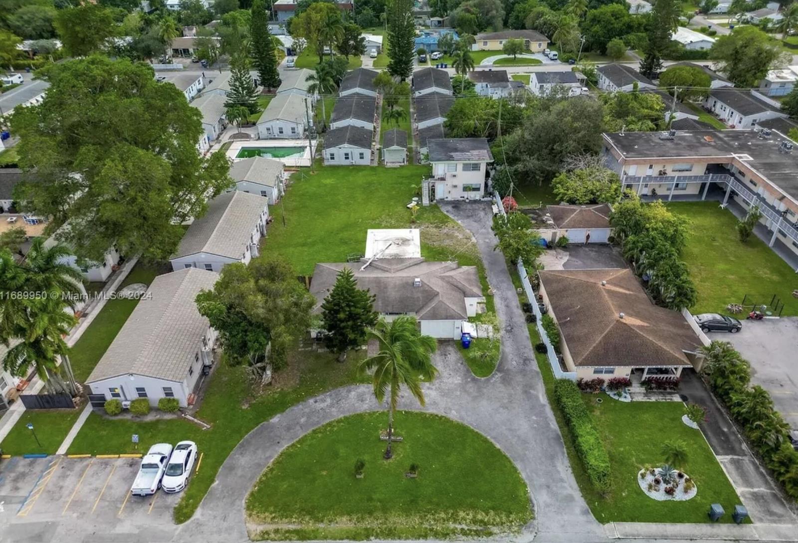 An aerial view shows a residential property with multiple buildings, a circular driveway, and landscaping — 2646 Johnson Street, Hollywood FL 33020, HOLLYWOOD, FL