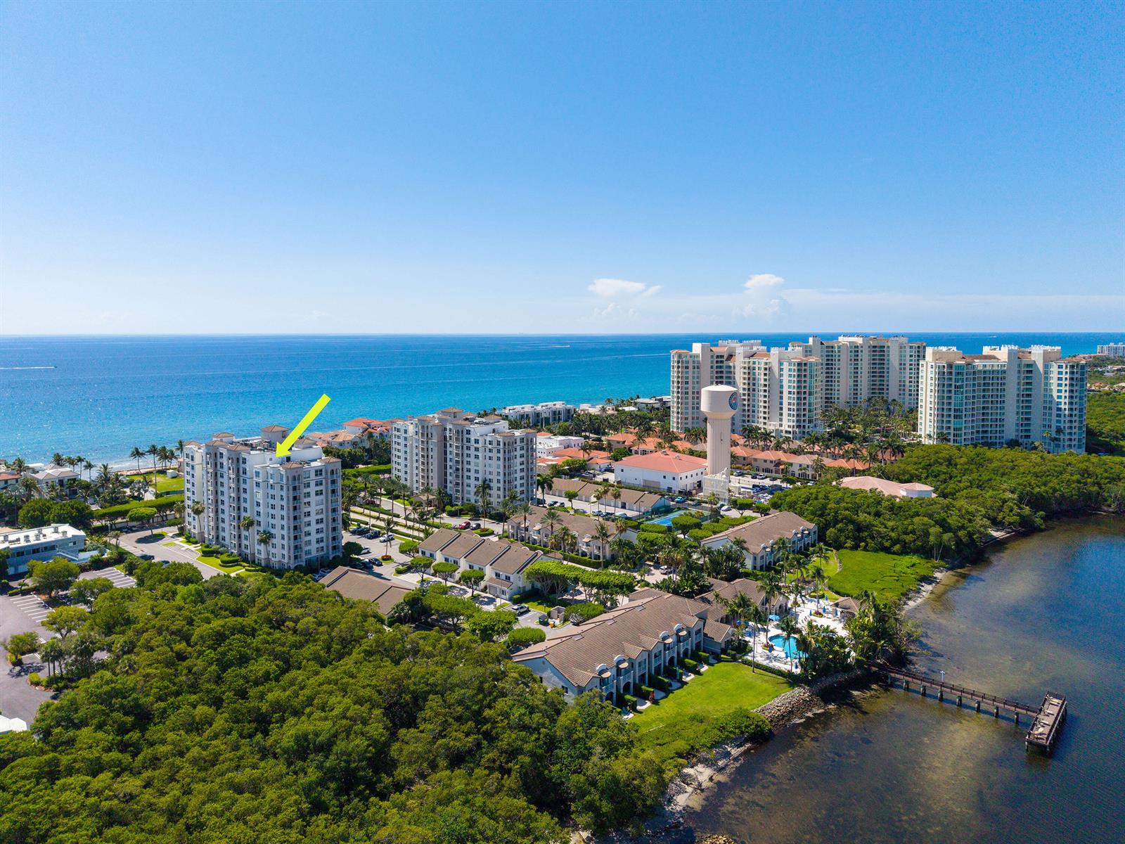 An aerial view shows a coastal residential complex with a yellow arrow pointing to a building — 3594 S Ocean Boulevard # 604, Highland Beach FL 33487, HIGHLAND BEACH, FL