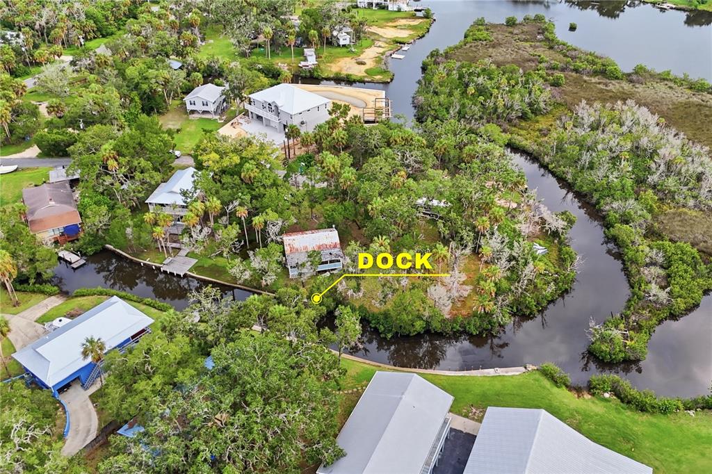 Aerial view of a waterfront property featuring a rustic shed and a small wooden dock — 14496 & 14498 W CAPTAIN COURT, CRYSTAL RIVER, FL