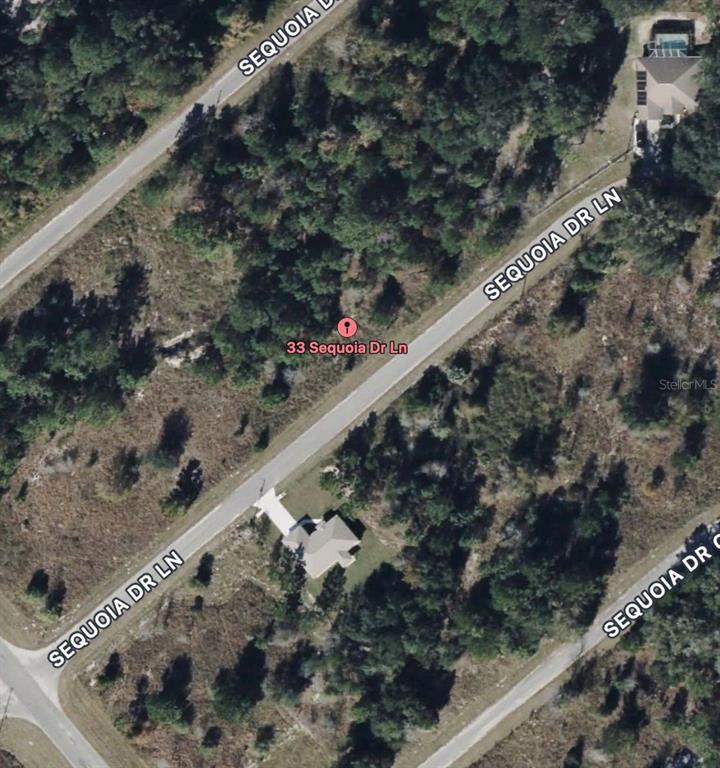 This aerial map shows a residential lot with a house and surrounding wooded area — 33 SEQUOIA DRIVE LANE, OCKLAWAHA, FL