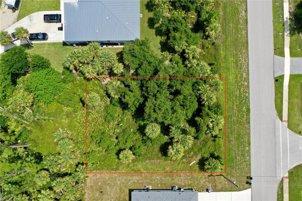 An aerial view shows a rectangular vacant lot outlined in red, surrounded by vegetation — NORDENDALE BOULEVARD, NORTH PORT, FL