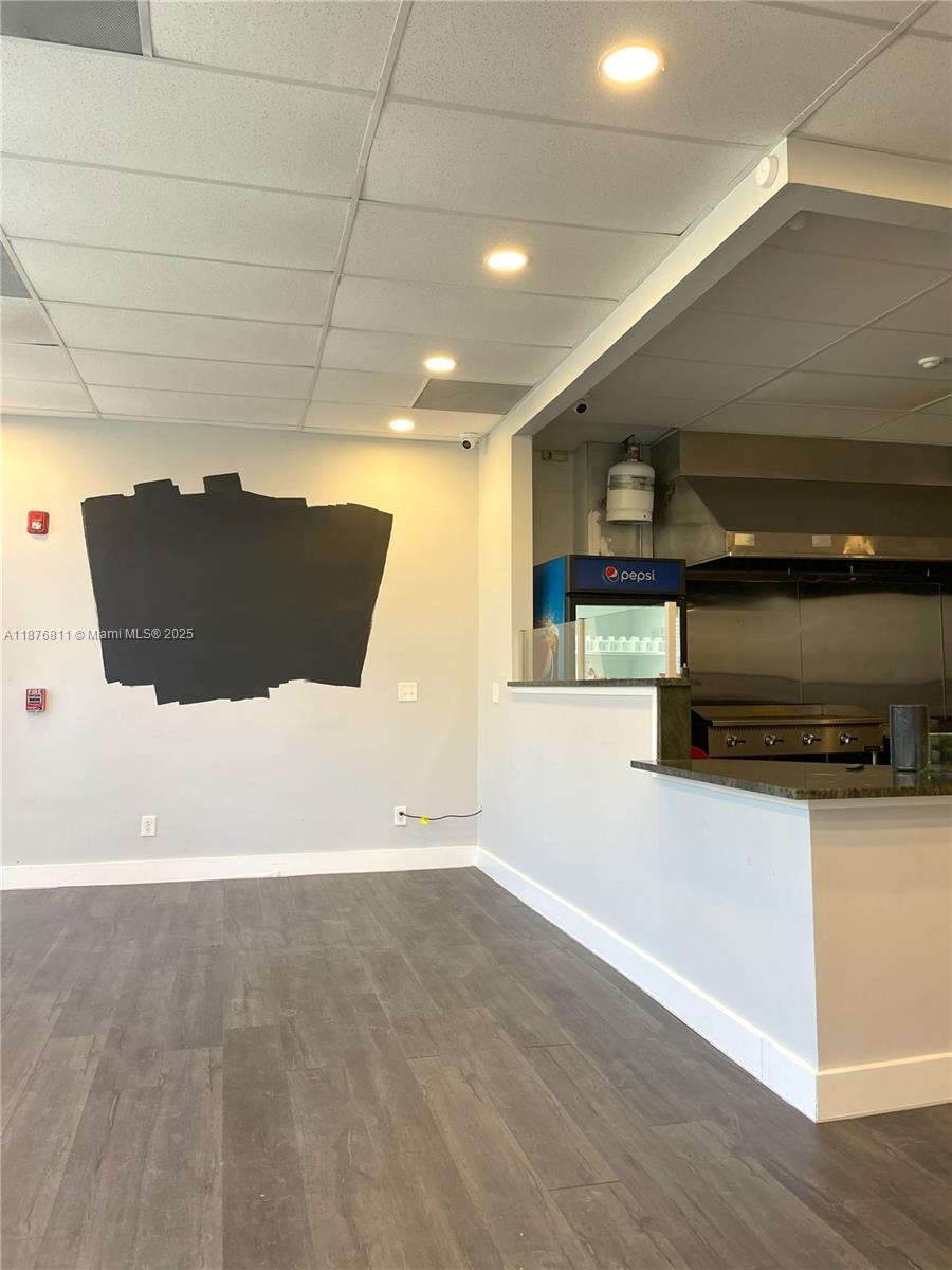 This commercial space features a kitchen area with a counter, grey flooring, and recessed lighting — 550 Piedmont Ave, GA 30308, GA