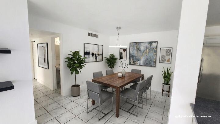 This is a digitally staged dining room featuring a wooden table, six chairs, and tile flooring — 517 Dotterel Road # 31c, Delray Beach FL 33444, DELRAY BEACH, FL