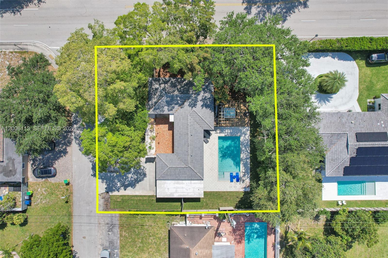 An aerial view shows a house with a swimming pool and trees within a yellow border — 2 NW 89th St, El Portal FL 33150, EL PORTAL, FL