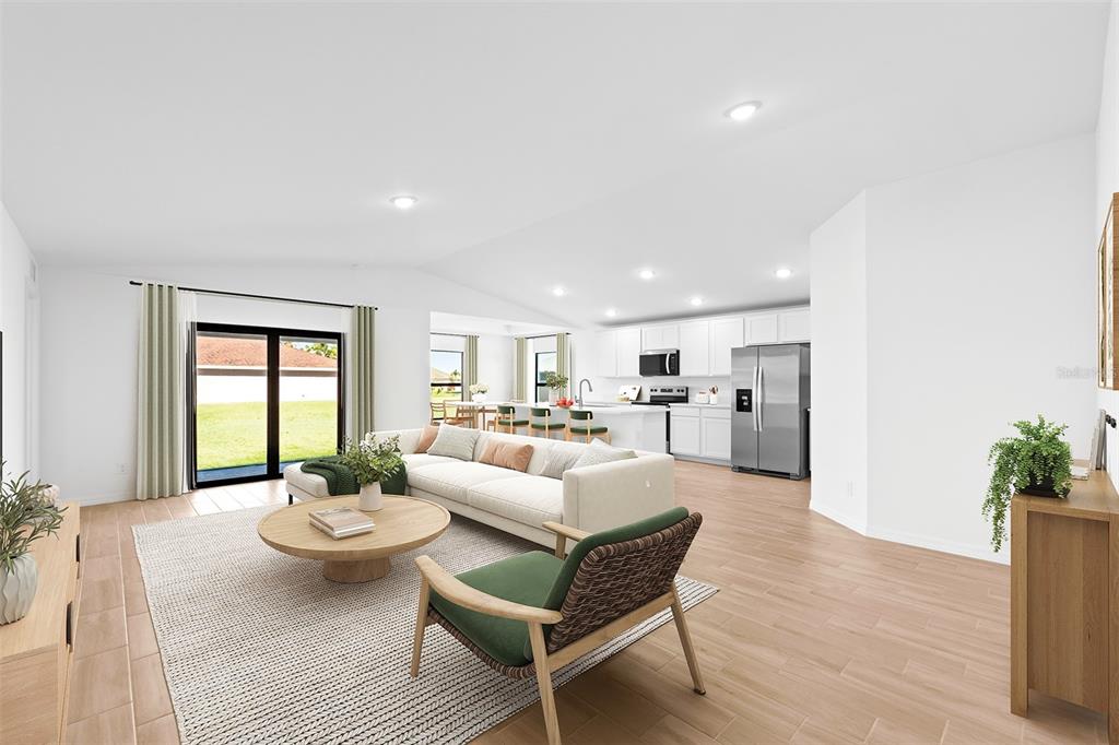 This is a digital rendering of an open-concept living room and kitchen with light flooring — 2860 W BUCCANEER LANE, CITRUS SPRINGS, FL