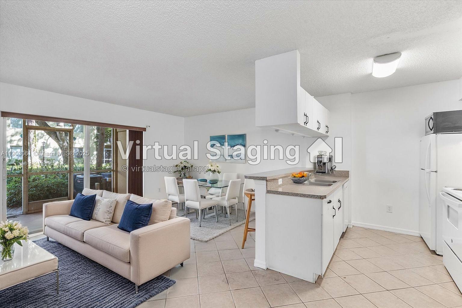 This virtual staging shows an open-concept living and dining area with a kitchen peninsula — 450 S Park Rd # 105, Hollywood FL 33021, HOLLYWOOD, FL