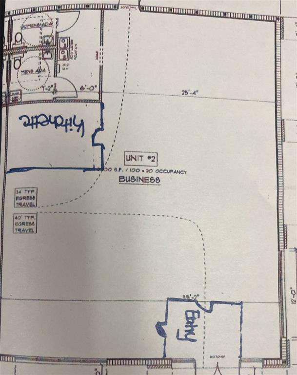 This is a floor plan for a commercial business unit featuring a kitchenette and restrooms — 2019 21 STREET NW, WINTER HAVEN, FL