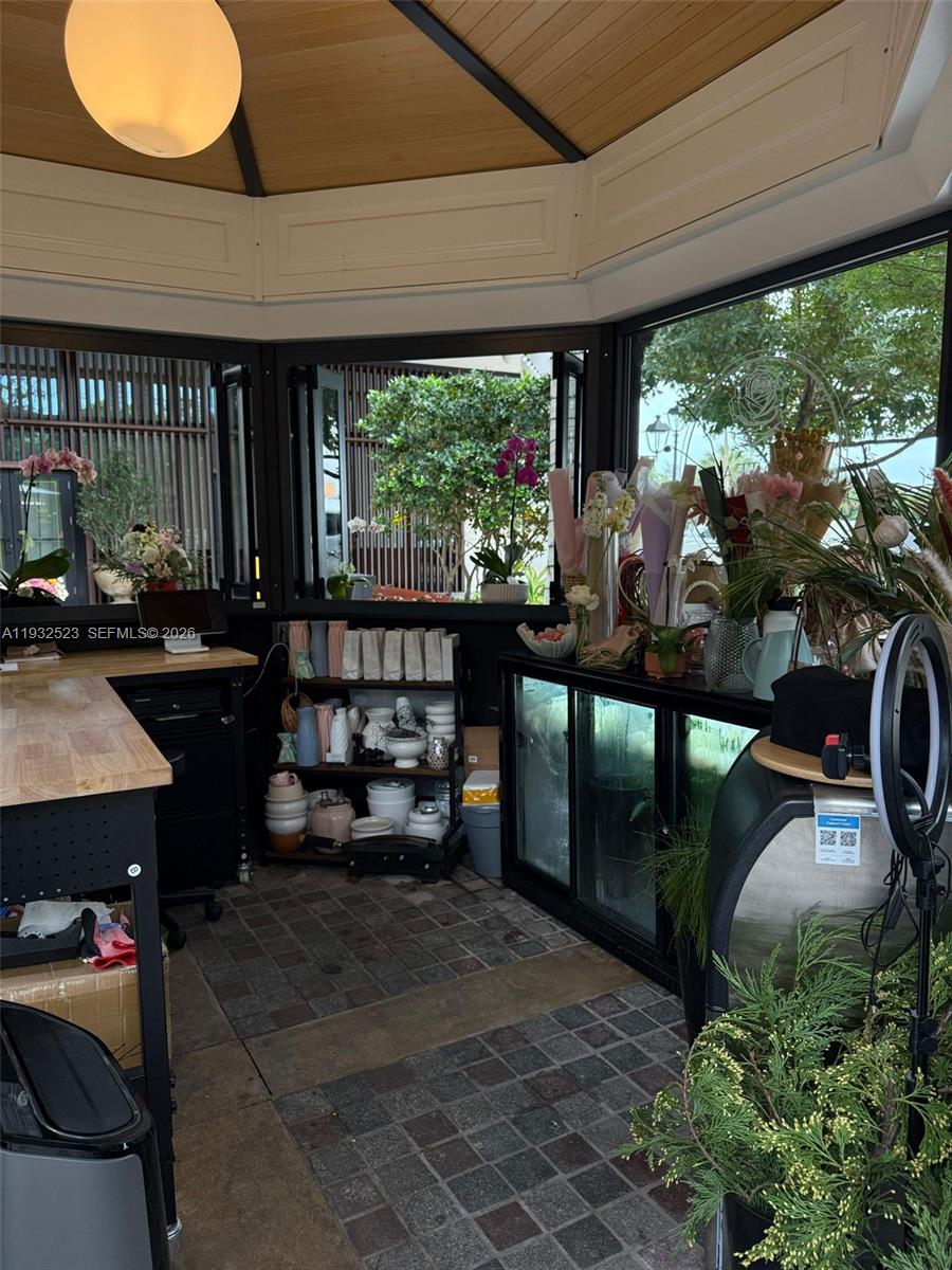 A sunlit floral shop features a wooden ceiling, tiled floor, and large glass windows — 3011 Ponce de Leon Blvd, Coral Gables FL 33134, CORAL GABLES, FL