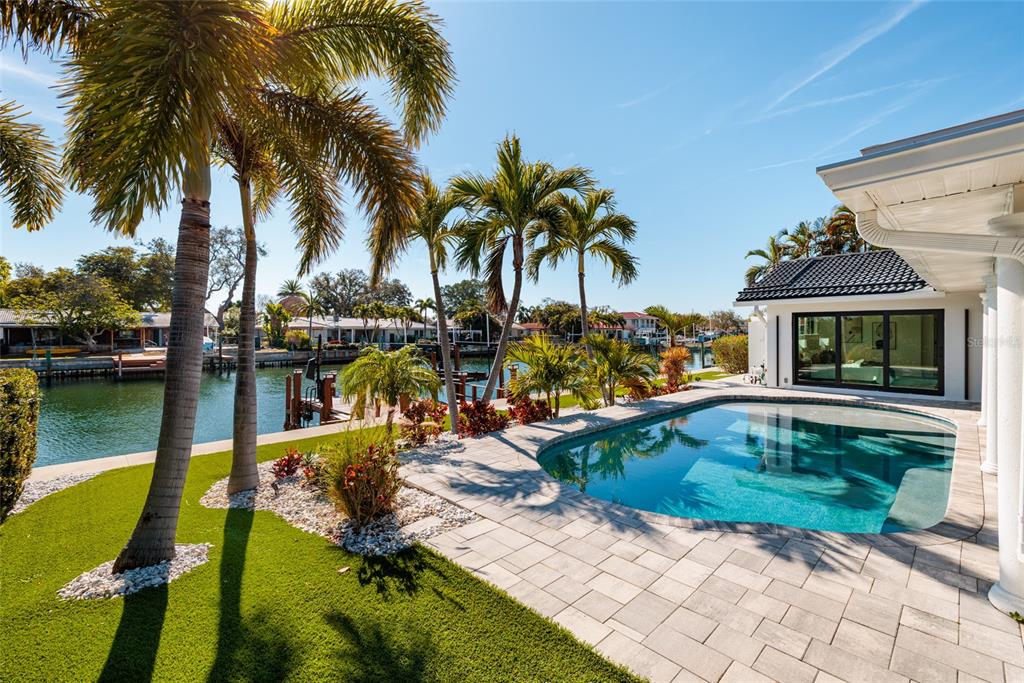 An aerial view of a waterfront house with a private dock and swimming pool — 2032 KANSAS AVENUE NE, ST PETERSBURG, FL