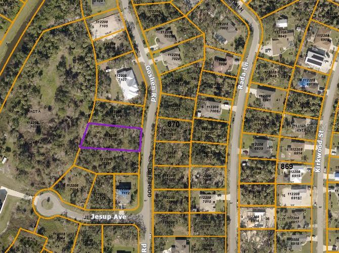This is an aerial map showing a highlighted vacant lot among residential properties — GOSHEN ROAD, NORTH PORT, FL