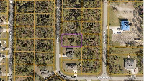 This is an aerial map showing a vacant lot highlighted in purple among residential properties — STARFISH AVENUE, NORTH PORT, FL