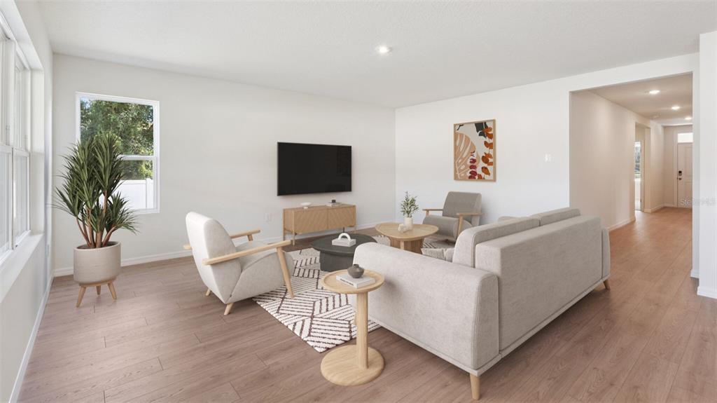 This is a digital rendering of a living room with light wood floors and neutral furniture — 24282 NW 13TH BOULEVARD, NEWBERRY, FL
