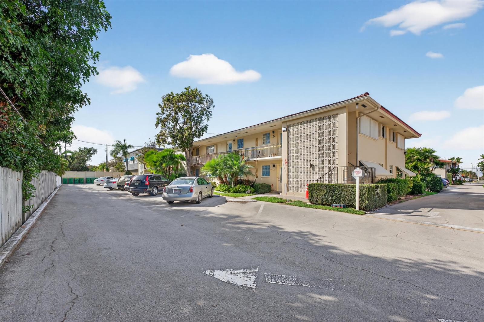 A two-story apartment building with a decorative concrete screen wall and a parking lot — 2134 NE 36th Street # 82, Lighthouse Point FL 33064, LIGHTHOUSE POINT, FL