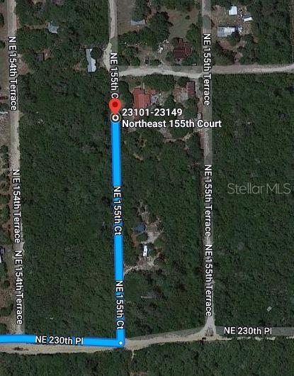 This is a satellite map showing a residential street layout with highlighted road segments — NE 155TH COURT, FORT MC COY, FL