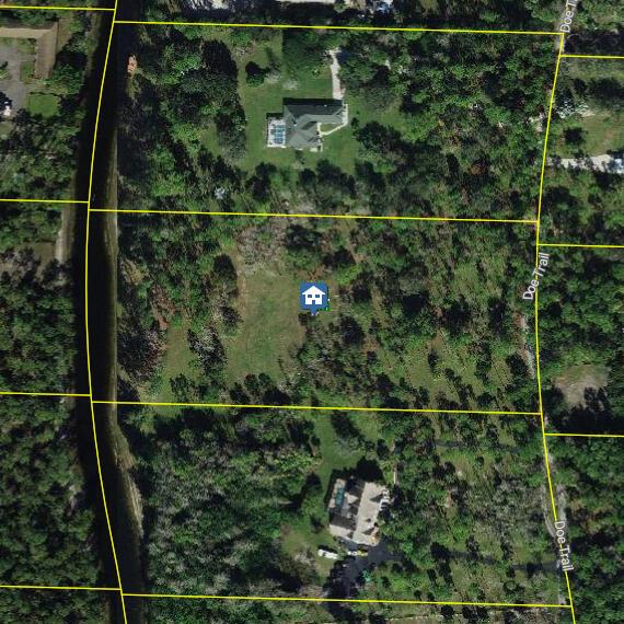 This aerial map shows a vacant residential lot situated between two houses on Doe Trail — 2795 Doe Trail, Loxahatchee FL 33470, LOXAHATCHEE, FL