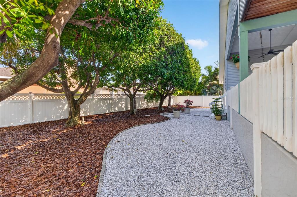 A kitchen with cream cabinets, granite countertops, stainless steel appliances, and a tray ceiling — 615 MONTE CRISTO BOULEVARD, ST PETERSBURG, FL