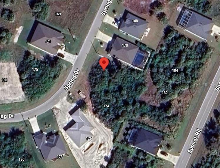 This is an aerial map view showing a vacant lot marked with a red pin — 172 SPRING DRIVE, ROTONDA WEST, FL