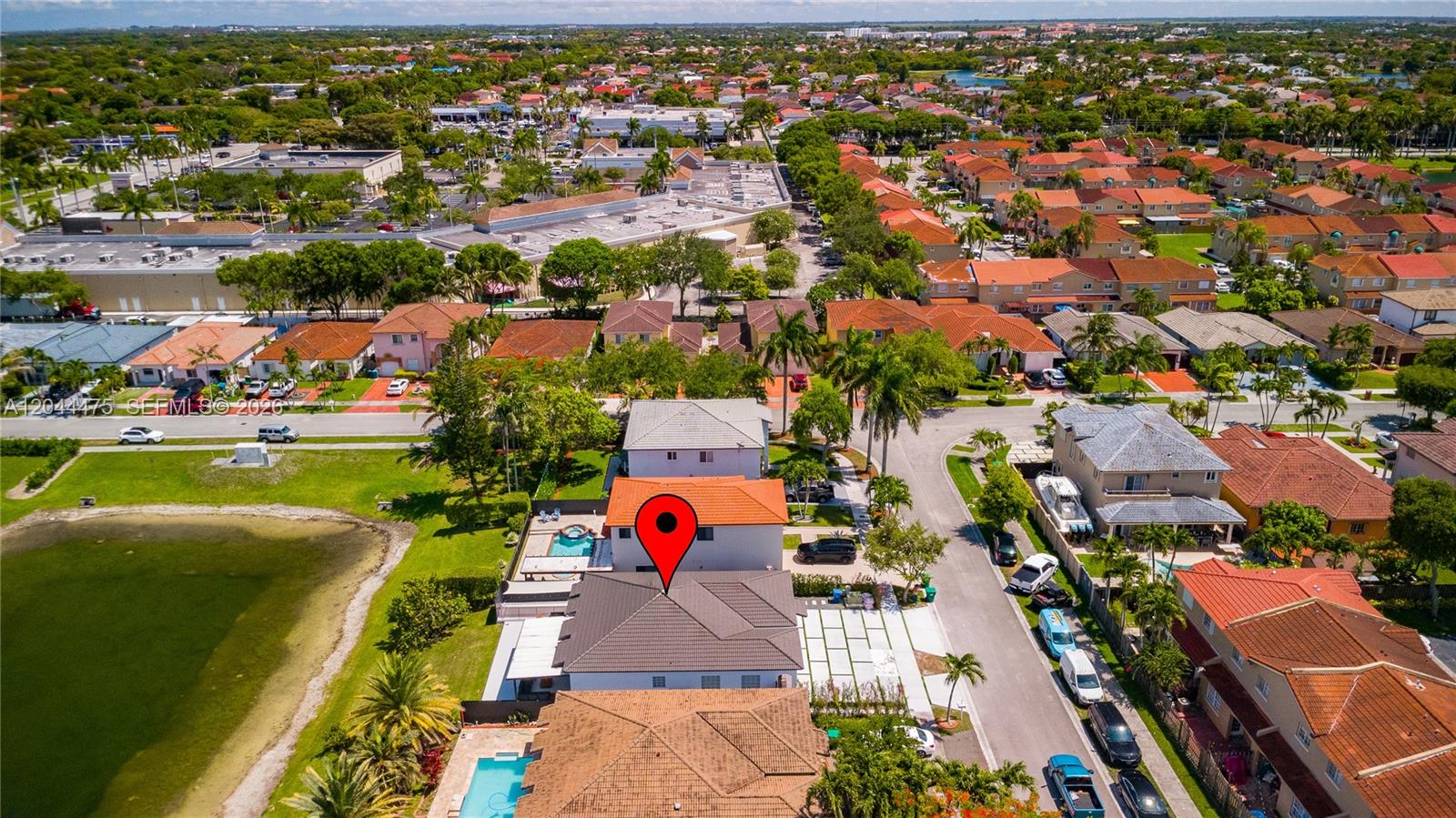 An aerial view shows a residential neighborhood with a red-roofed house marked by a pin — 6939 SW 158th Ave, Miami FL 33193, MIAMI, FL
