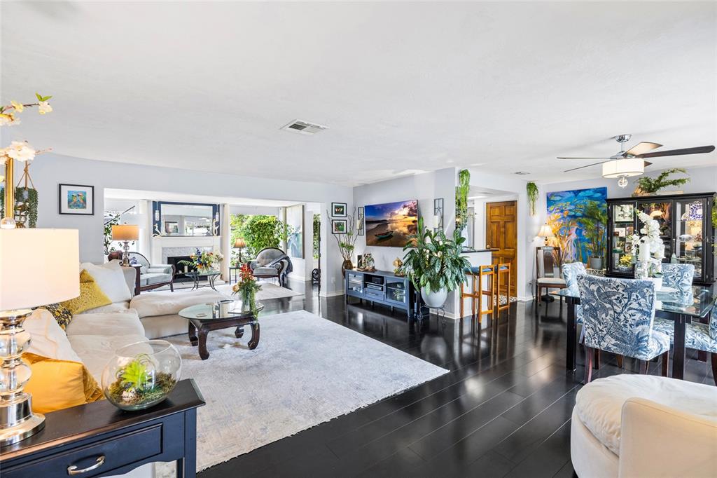 An entryway features a black front door, a crystal light fixture, and a wooden console table — 14006 81ST AVENUE, SEMINOLE, FL