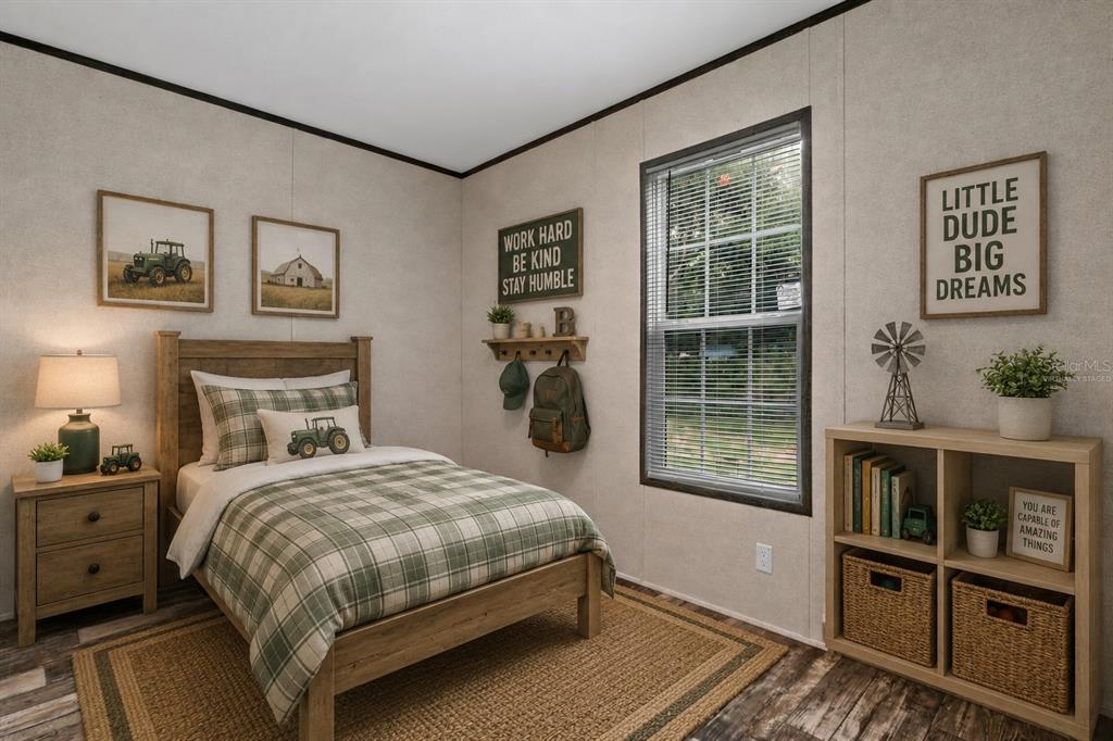 A bedroom features a twin bed, a wooden nightstand, a bookshelf, and farm-themed wall decor — 4363 CR 690, WEBSTER, FL