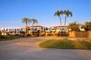 A low-rise apartment building with palm trees stands behind a paved parking lot at sunset — 2351 SW 92nd Pl, Miami FL 33165, MIAMI, FL