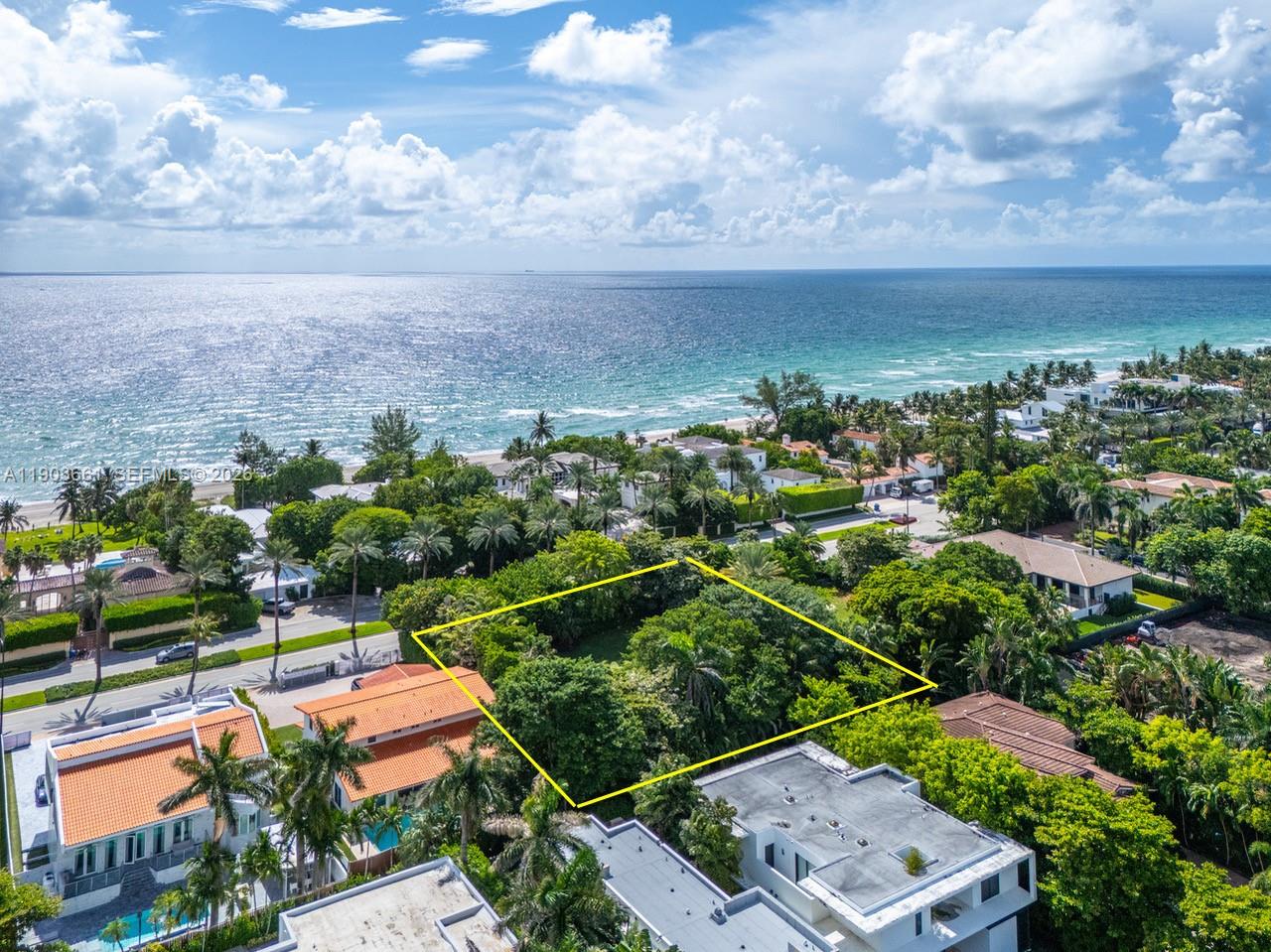 An aerial view shows a vacant, tree-filled rectangular lot outlined in yellow near the ocean — 326 Ocean Blvd, Golden Beach FL 33160, GOLDEN BEACH, FL