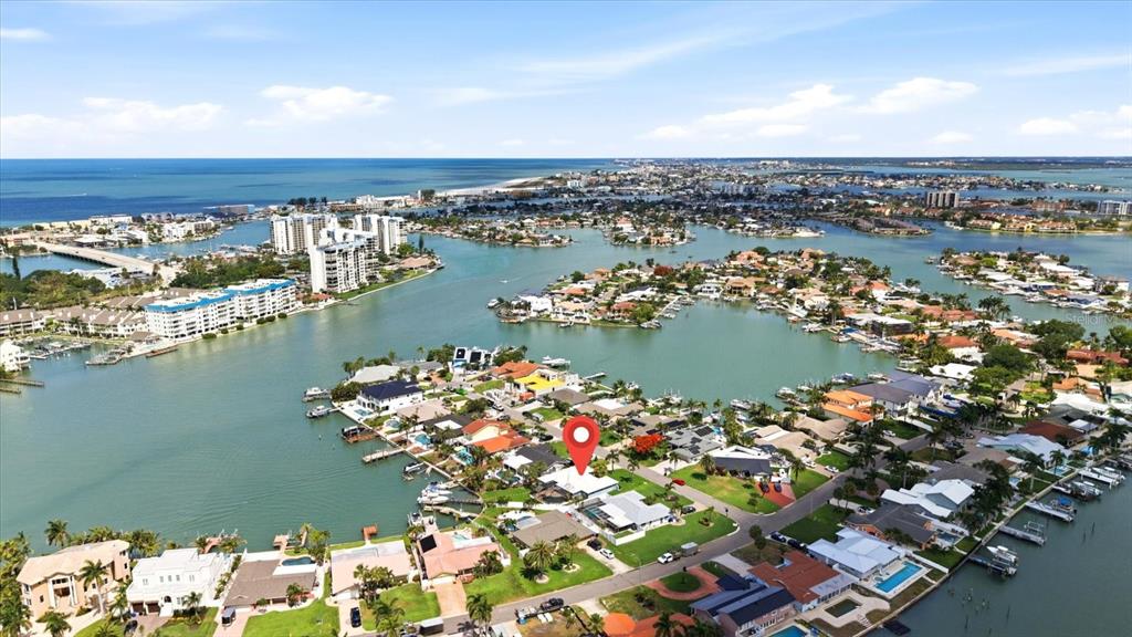 An aerial view shows a waterfront residential neighborhood with a red location pin — 8008 13TH AVENUE S, ST PETERSBURG, FL