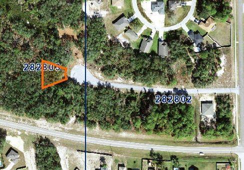 This aerial map shows two highlighted vacant lots located near a residential cul-de-sac — 123 WARMOUTH LANE, POINCIANA, FL