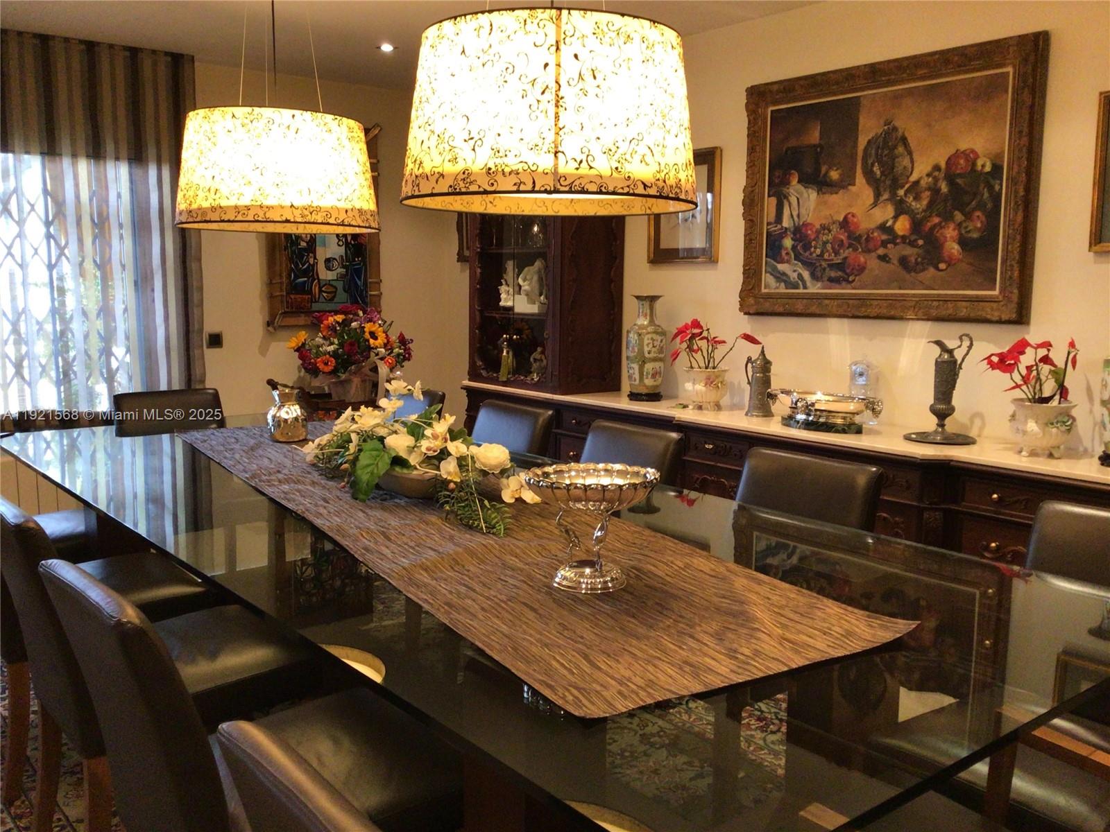 A dining room features a glass-topped table, dark leather chairs, and two large patterned pendant lights — 17 Canonge Domenech, PA 17310, PA