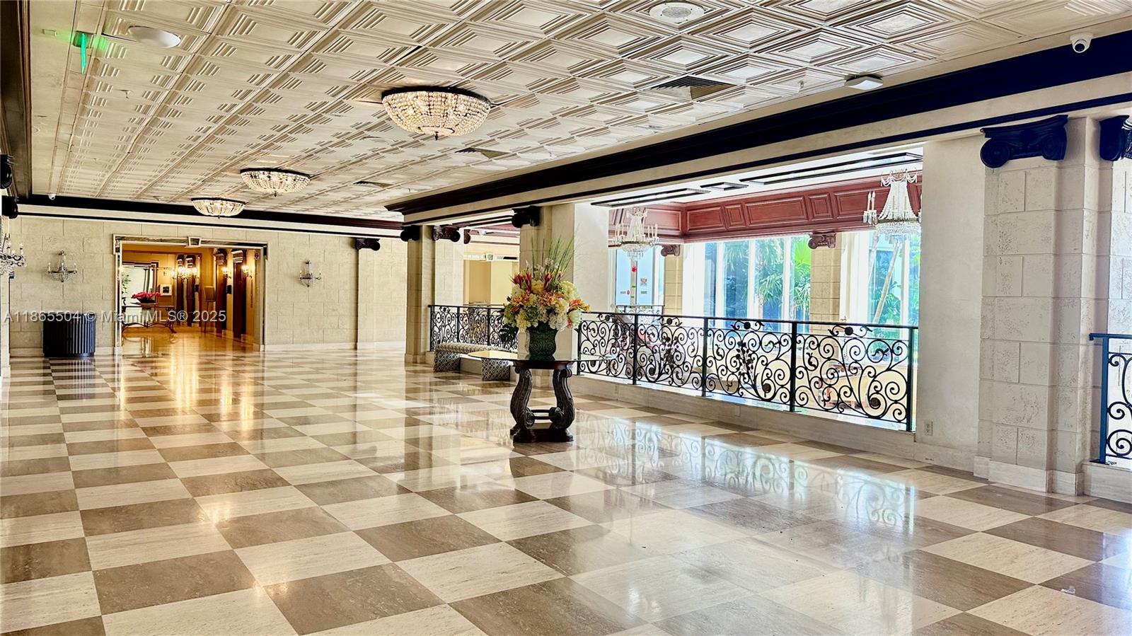 A spacious lobby features a checkered marble floor, coffered ceiling, and ornate metal railings — 2030 S Ocean Dr # 1022, Hallandale Beach FL 33009, HALLANDALE BEACH, FL