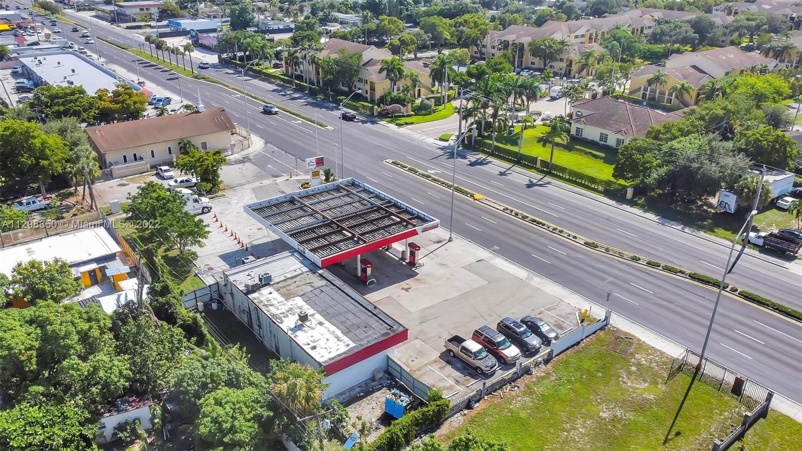 An aerial view shows a gas station with a canopy, convenience store, and parking lot — 1601 NW 119 St, North Miami FL 33167, NORTH MIAMI, FL