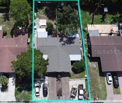 An aerial view shows a single-story house with a driveway and a fenced backyard — 4805 21ST STREET W, BRADENTON, FL