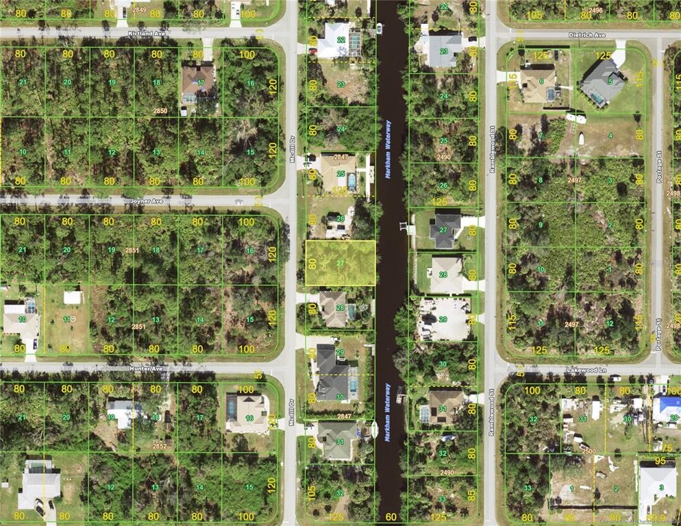 This is a map showing residential land parcels and a waterway in a suburban neighborhood — 222 MCDILL DRIVE, PORT CHARLOTTE, FL