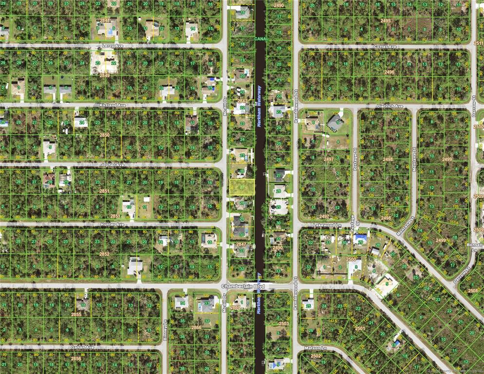 This is a satellite map view showing residential lots and a canal in a neighborhood — 222 MCDILL DRIVE, PORT CHARLOTTE, FL