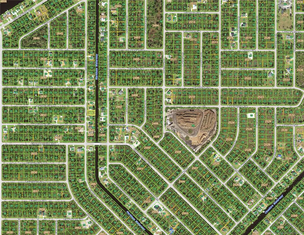 This is a map showing residential lots, streets, and waterways in a suburban neighborhood — 222 MCDILL DRIVE, PORT CHARLOTTE, FL