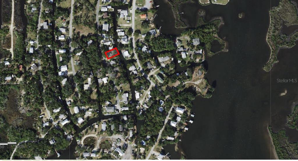 This aerial map shows a residential property highlighted in red along a canal — 2211 S HUNT POINT, CRYSTAL RIVER, FL