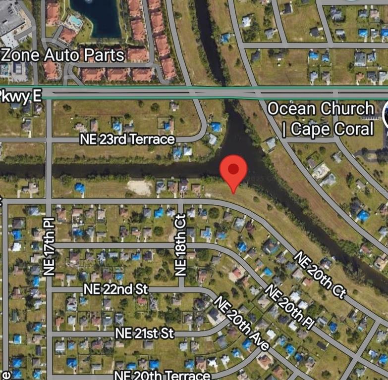 This is an aerial map view of a residential area with a red location pin — 1845 NE 23RD STREET, CAPE CORAL, FL