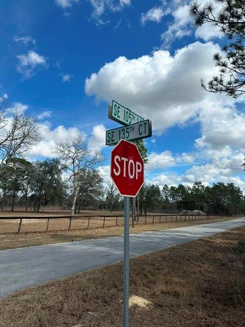A stop sign stands at the intersection of SE 105th Lane and SE 135th Court — 00 SE 135TH COURT, DUNNELLON, FL