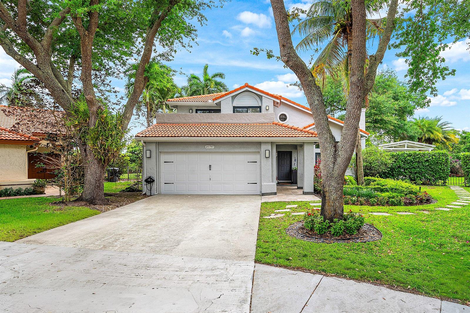 A two-story house with a white garage, tiled roof, and a large tree in front — 20797 Cabrillo Way, Boca Raton FL 33428, BOCA RATON, FL