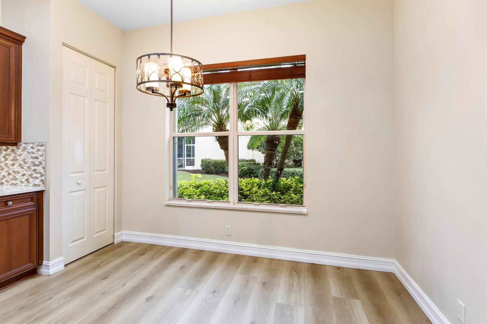 A swimming pool with lounge chairs and a clubhouse building under a blue sky — 10263 Orchid Reserve Drive # 21b, FL 33412, FL