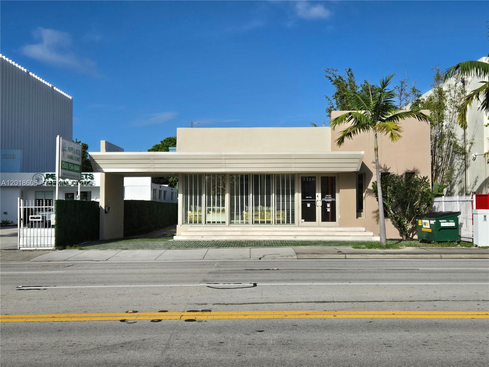 A single-story commercial building with a flat roof, large windows, and a prominent front canopy — 7320 Biscayne Blvd, Miami FL 33138, MIAMI, FL