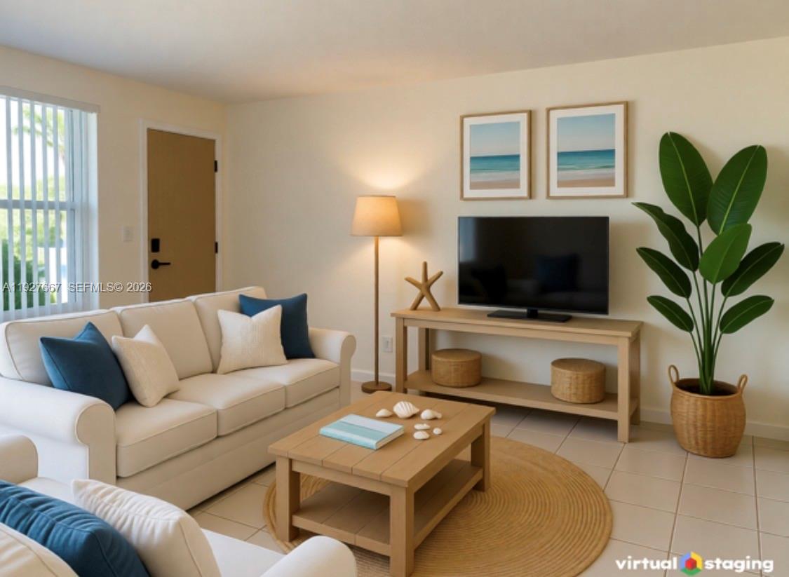 This virtual staging rendering shows a living room with a sofa, coffee table, and television — 255 Sunrise Dr # 103, Key Biscayne FL 33149, KEY BISCAYNE, FL