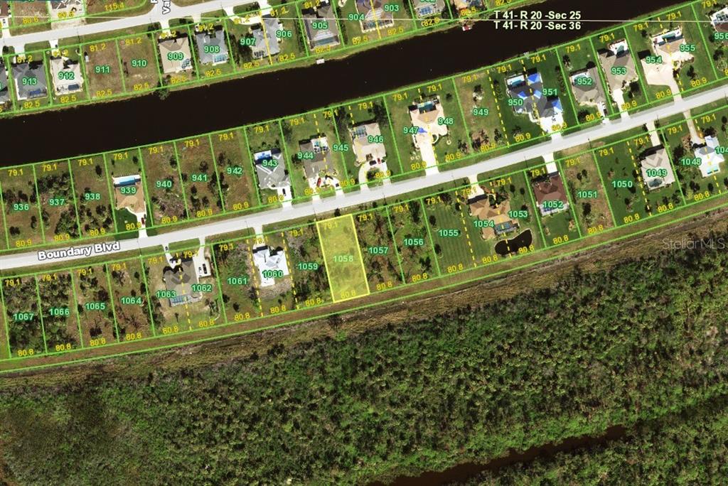 This is an aerial map showing residential lots along a canal and a road — 1155 BOUNDARY BOULEVARD, ROTONDA WEST, FL